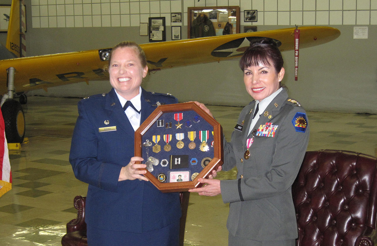 Captain Margarita Perez with her Commanding Officer at her 2013 Retirement Ceremony