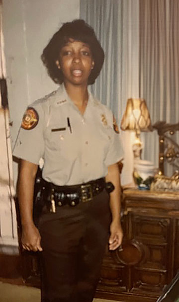 Maria McKee as a young officer
